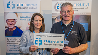 Scottish Water employees Yvonne Dunne and William Johnstone celebrate Carer Positive event in the workplace