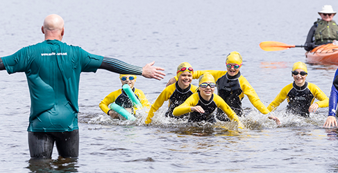 children and instruction in open water at Loch Lomond learning safety skills during Drowning Prevention Week
